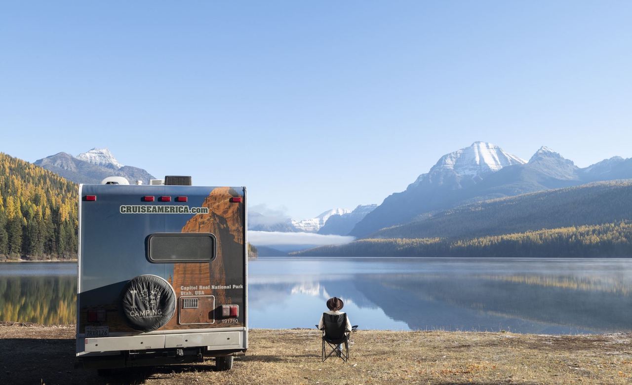 Picture of man relaxing in mountains by RV