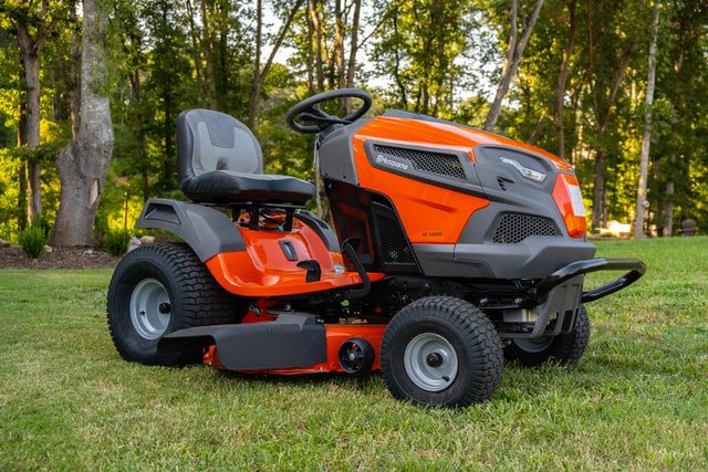 Riding mower parked on lawn